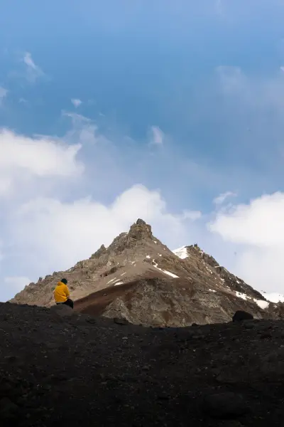 A Figure Admiring the view of a mountain.
